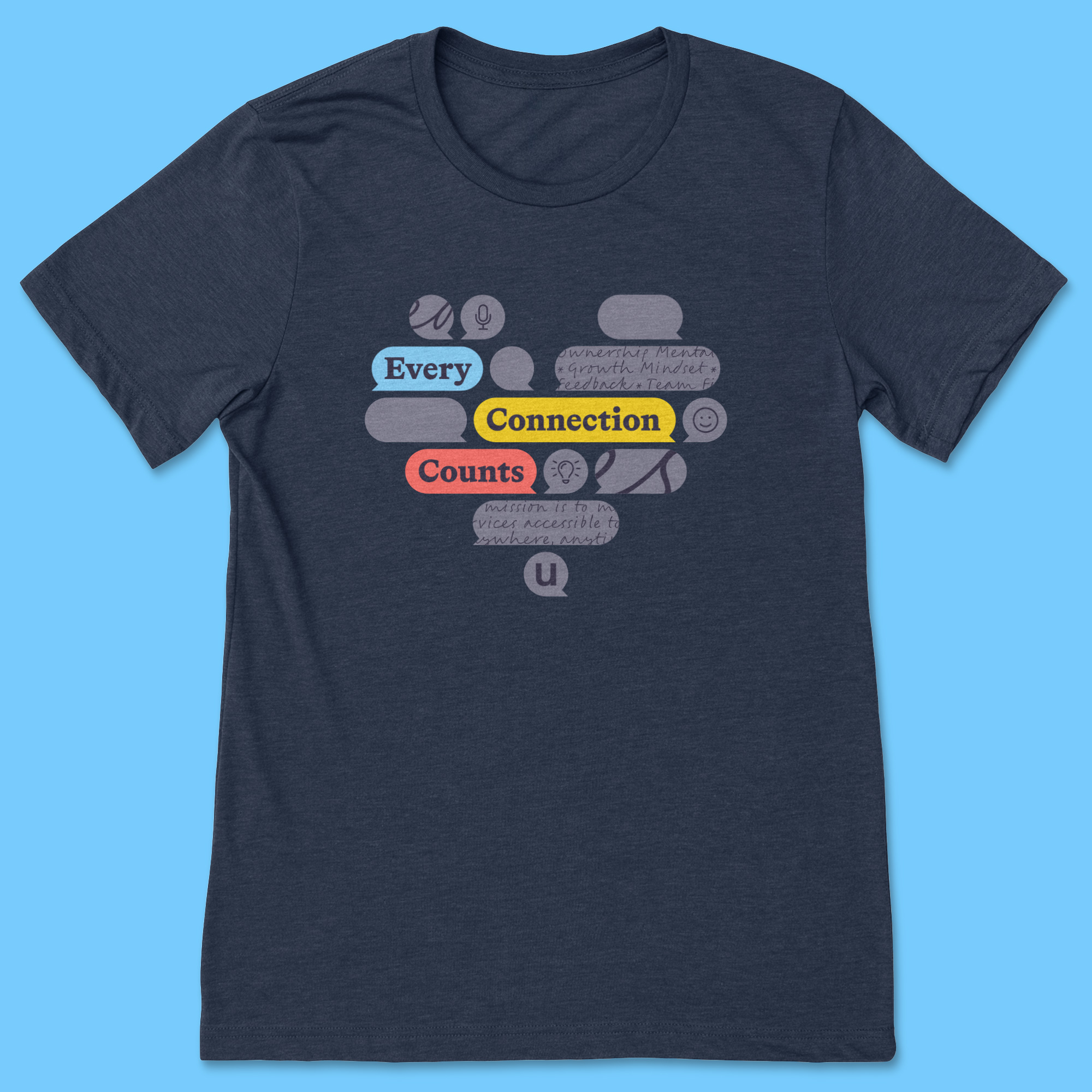 Heathered navy t-shirt with many light lavender geometric quote bubbles forming a heart shape. Three wide bubbles in blue, red, and gold say 'Every connection counts' and the remaining bubbles have a mix of icons, cursive handwriting, abstract lines, and blank designs.