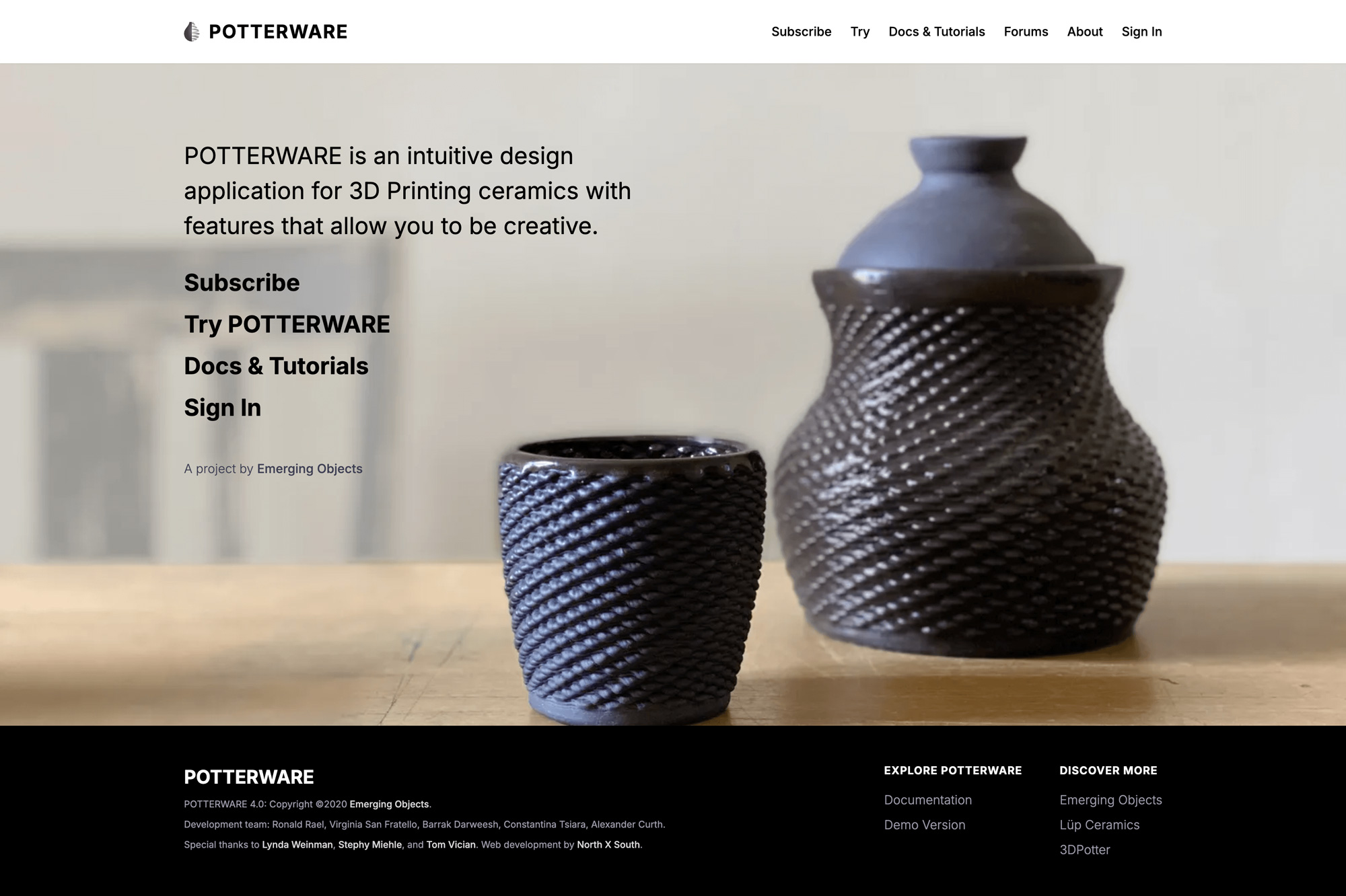 A minimal homepage design with stark, clean typography and a large hero image of 3D-printed pottery on a wooden table.